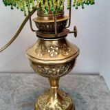 Brass lamp "La Parisienne" at the end of the 19th century.