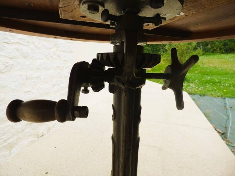 Unique bistro table with its adjustable industrial cast iron leg