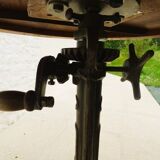 Unique bistro table with its adjustable industrial cast iron leg