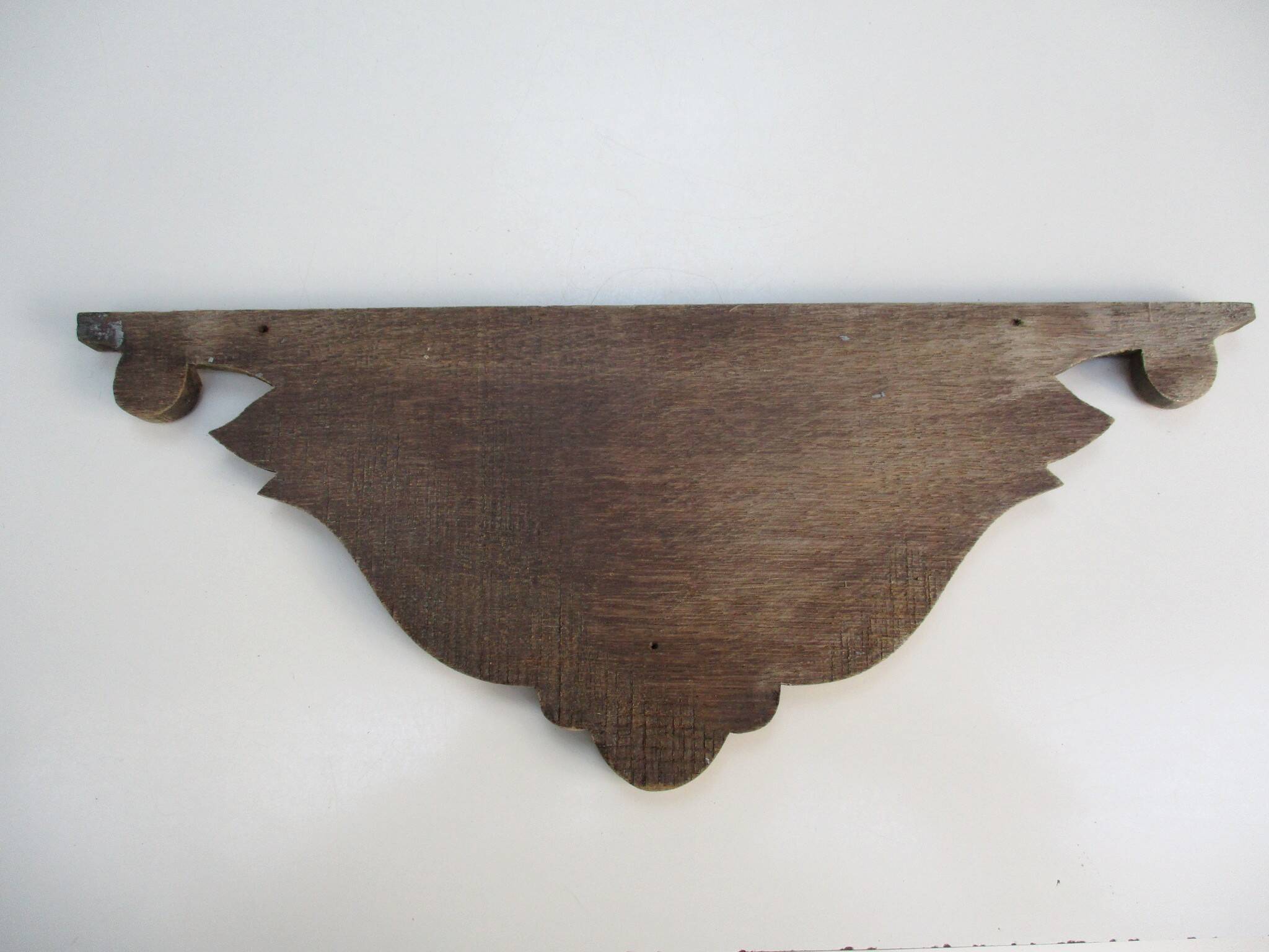 Old carved wooden pediment