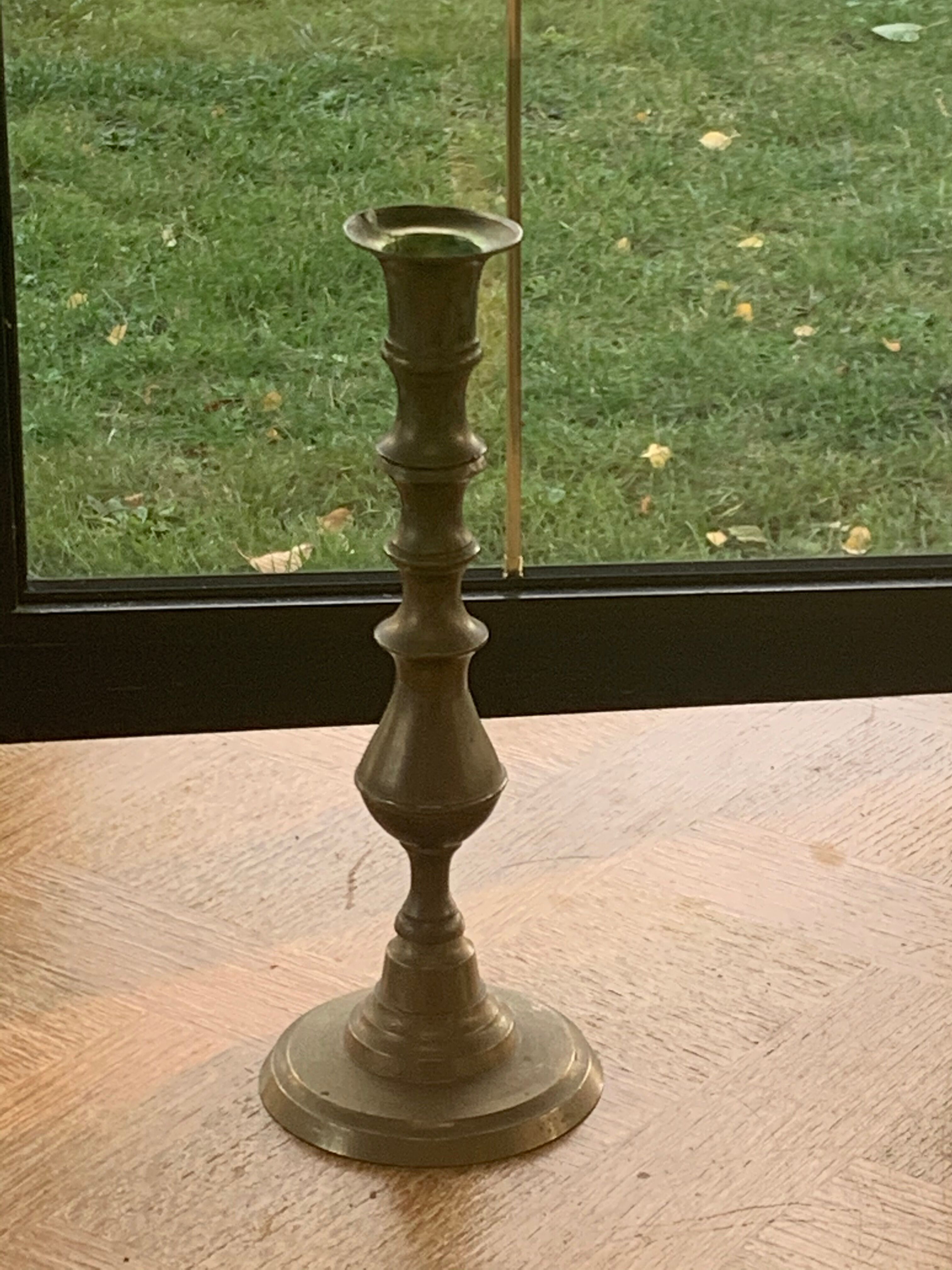 Brass candlestick, gold metal turns and chiseled original and vintage