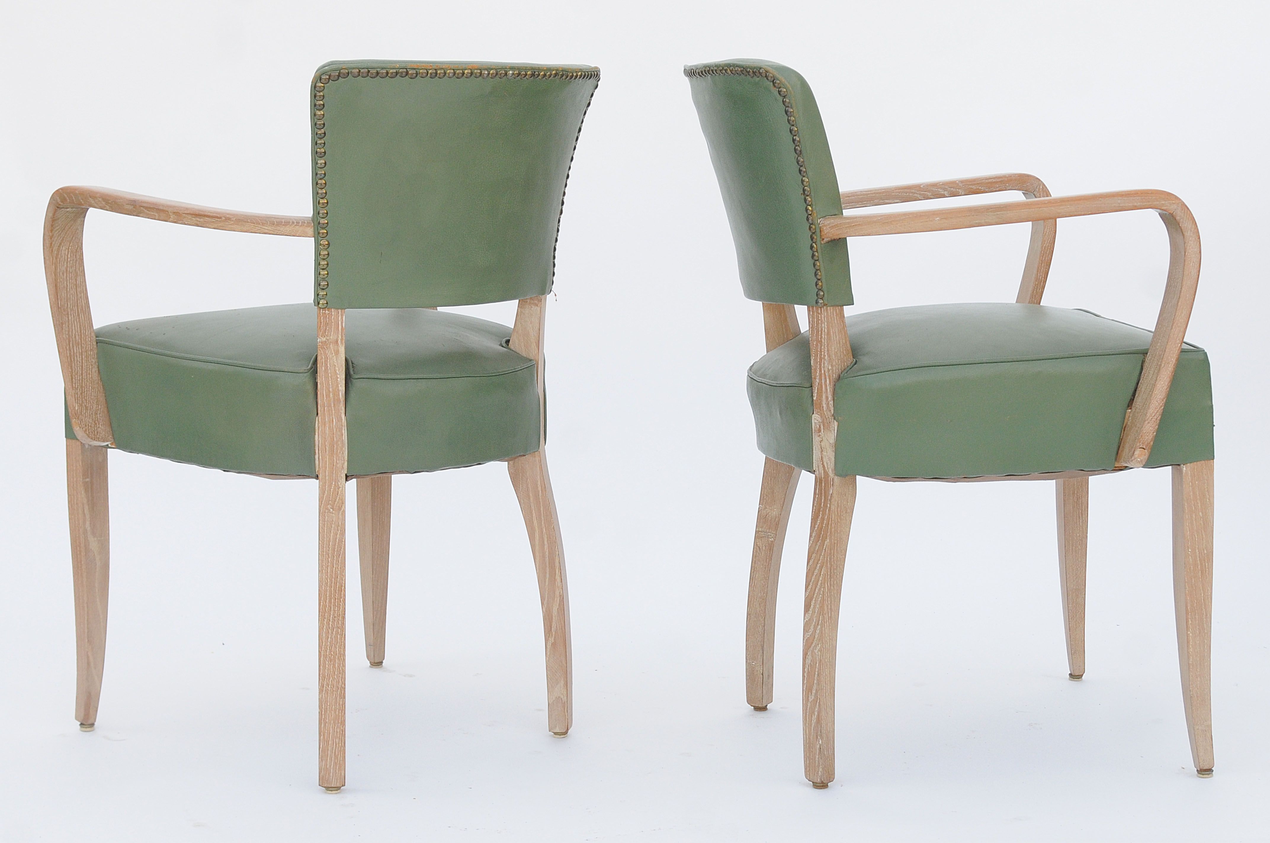 Pair of bridge chairs in cerus wood and green leather