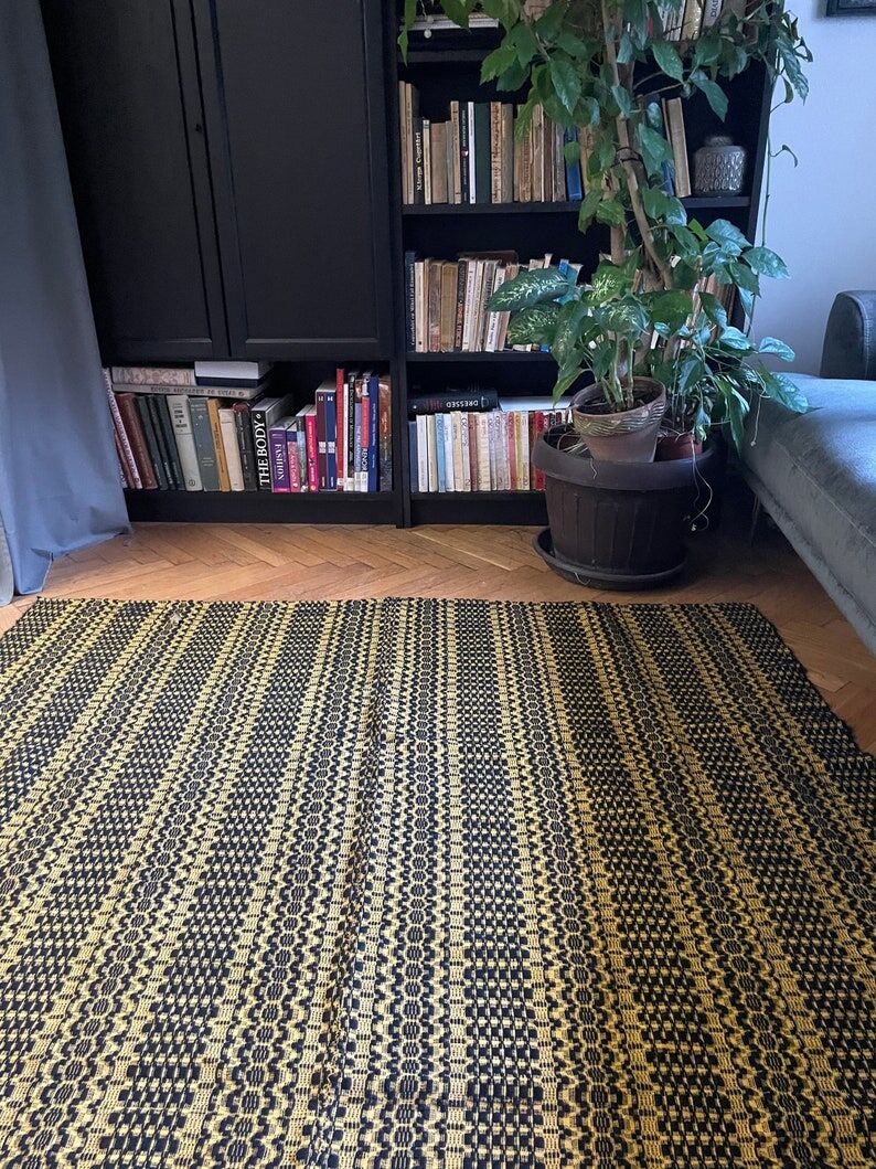 Romanian vintage carpet black design on a yellow background