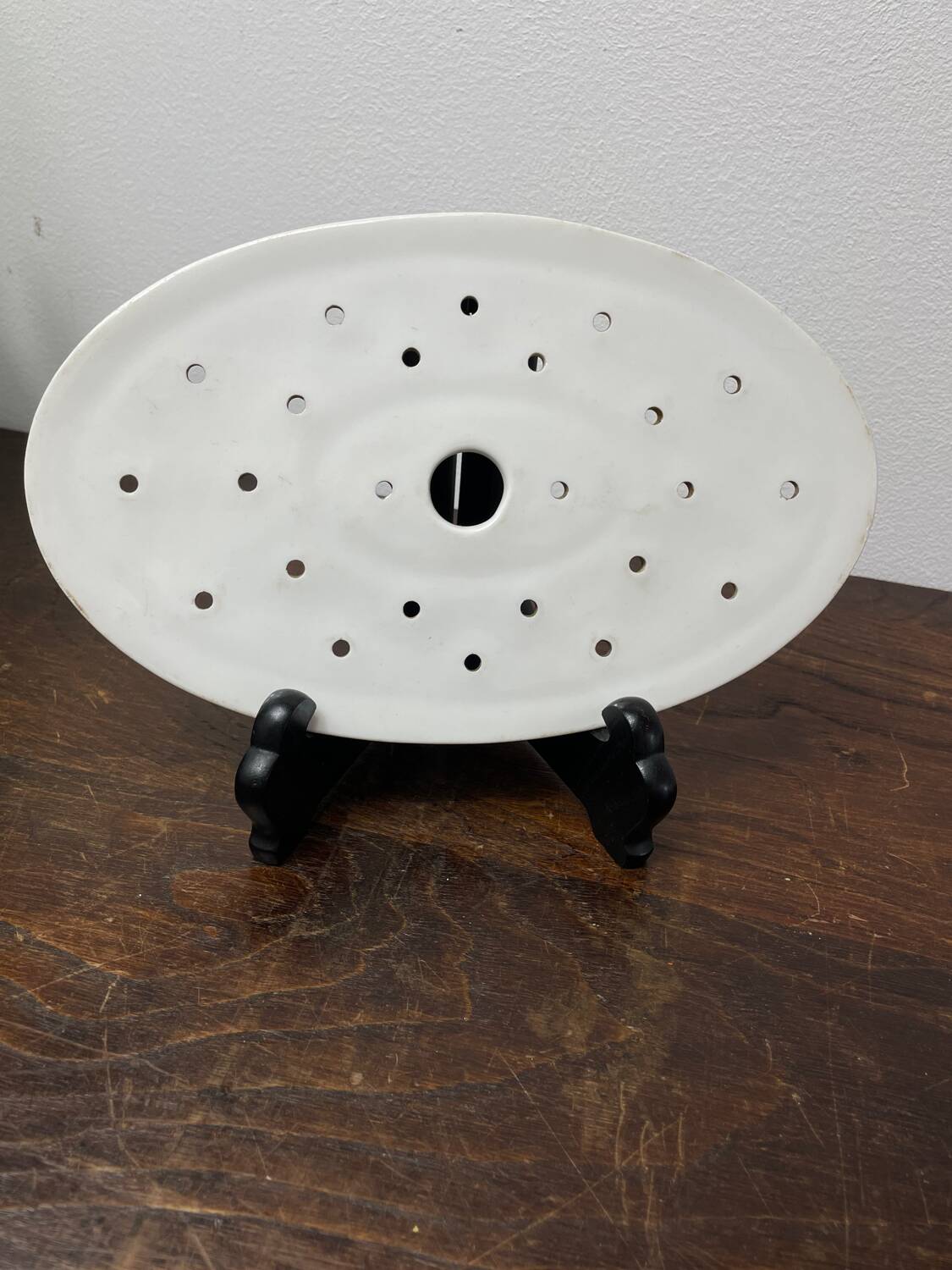 Old iron clay draining plate