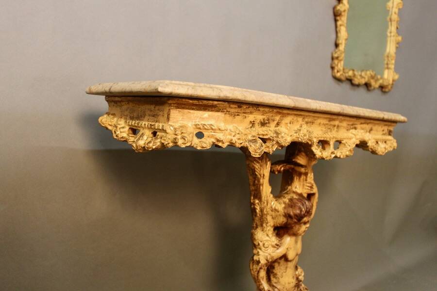 Marble top console and its rocaille style mirror