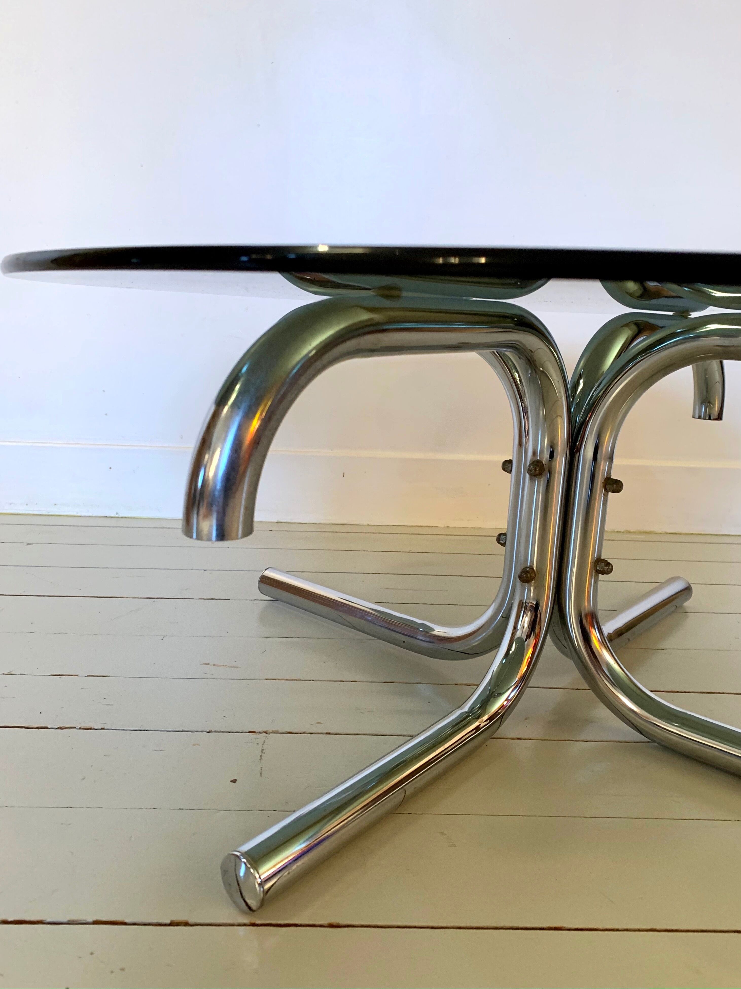 Glass and tubular metal coffee table