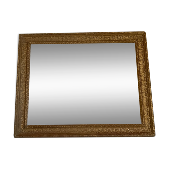 Old gilded wooden frame without glass