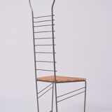 Pair of iron and straw chairs, 1980s.