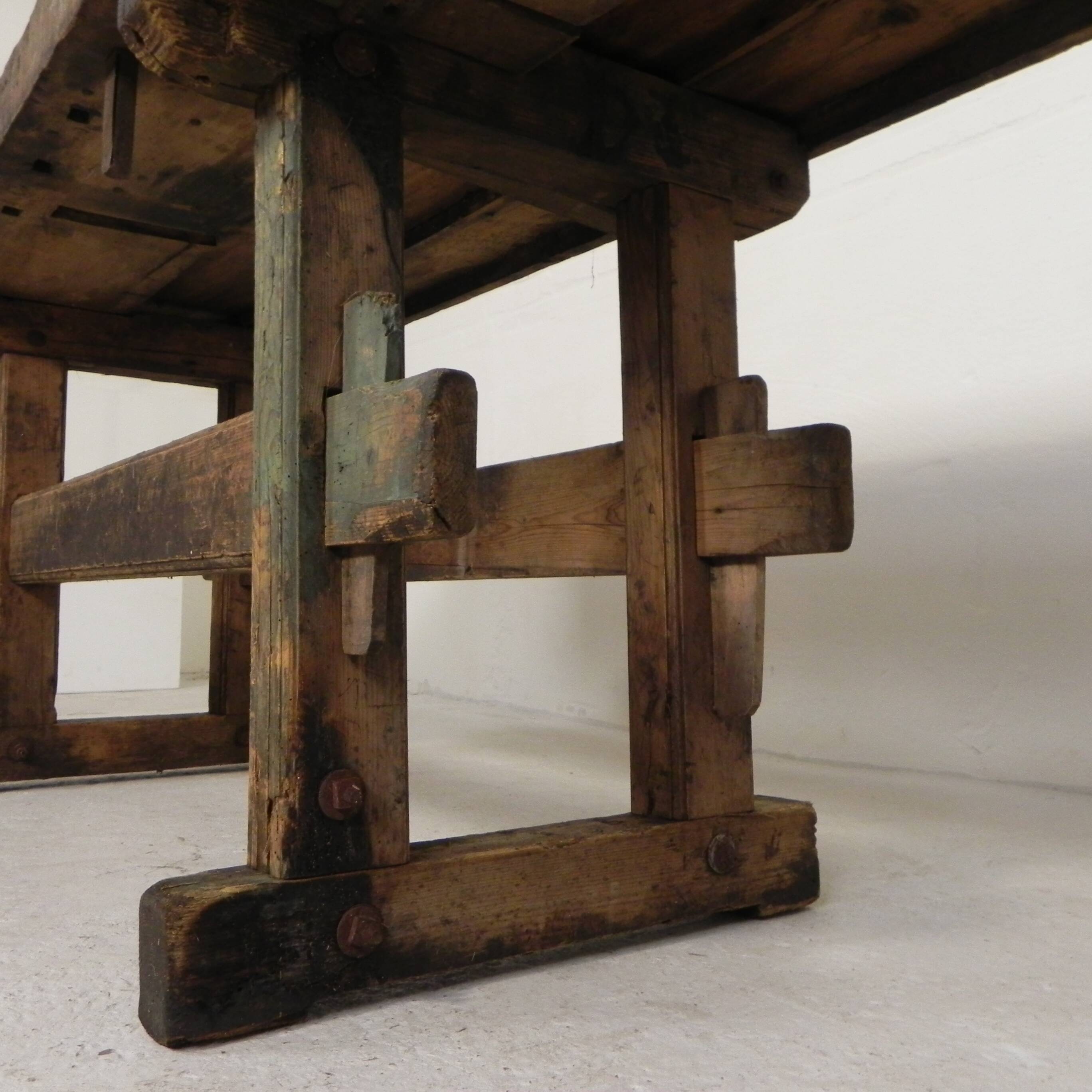Wooden industrial workbench with vice, 194 cm long, 1930s.