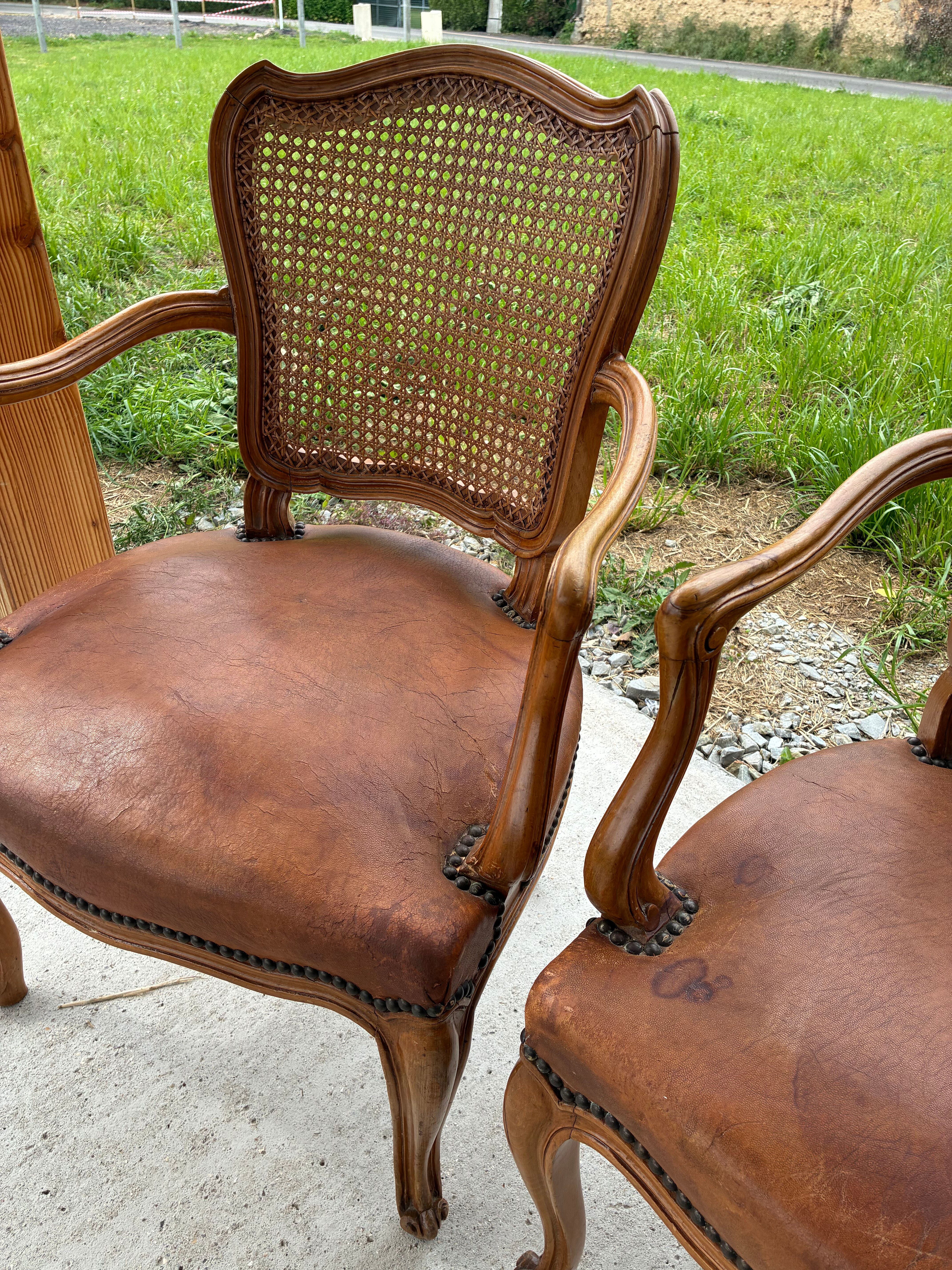 Cane and leather armchair in Louis XV style