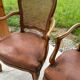 Cane and leather armchair in Louis XV style