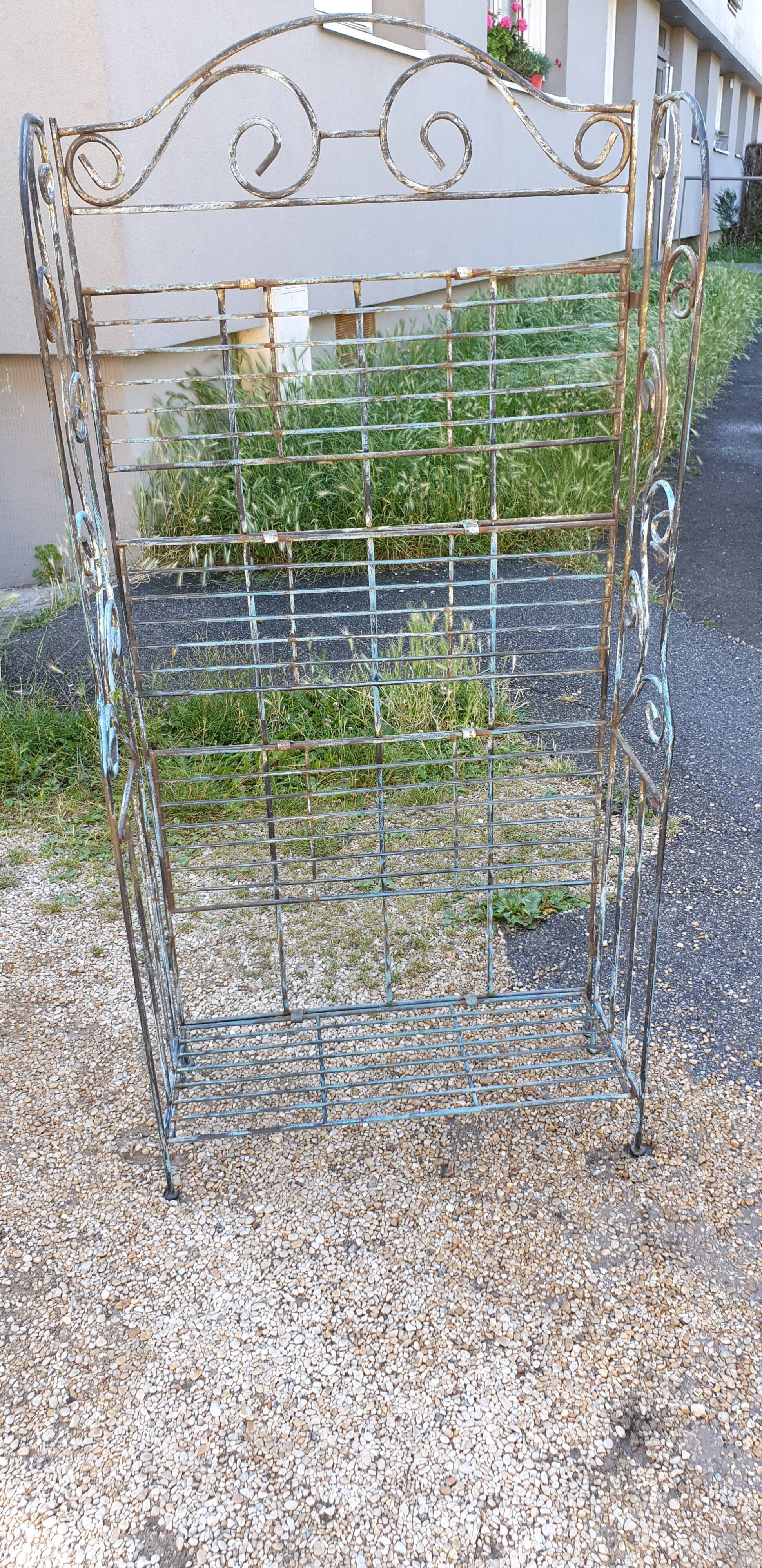 Wrought iron shelf on worked feet