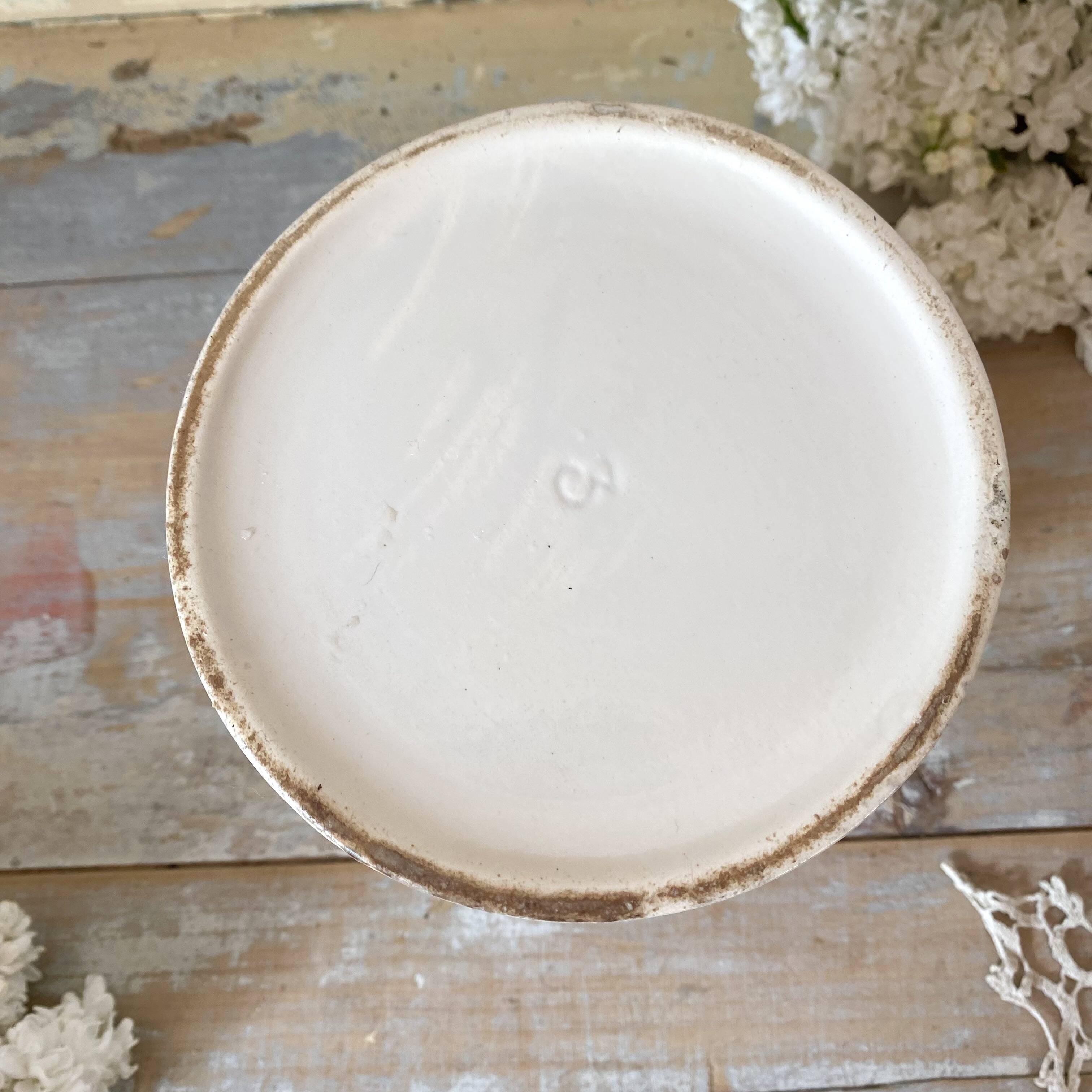 Old white earthenware jug