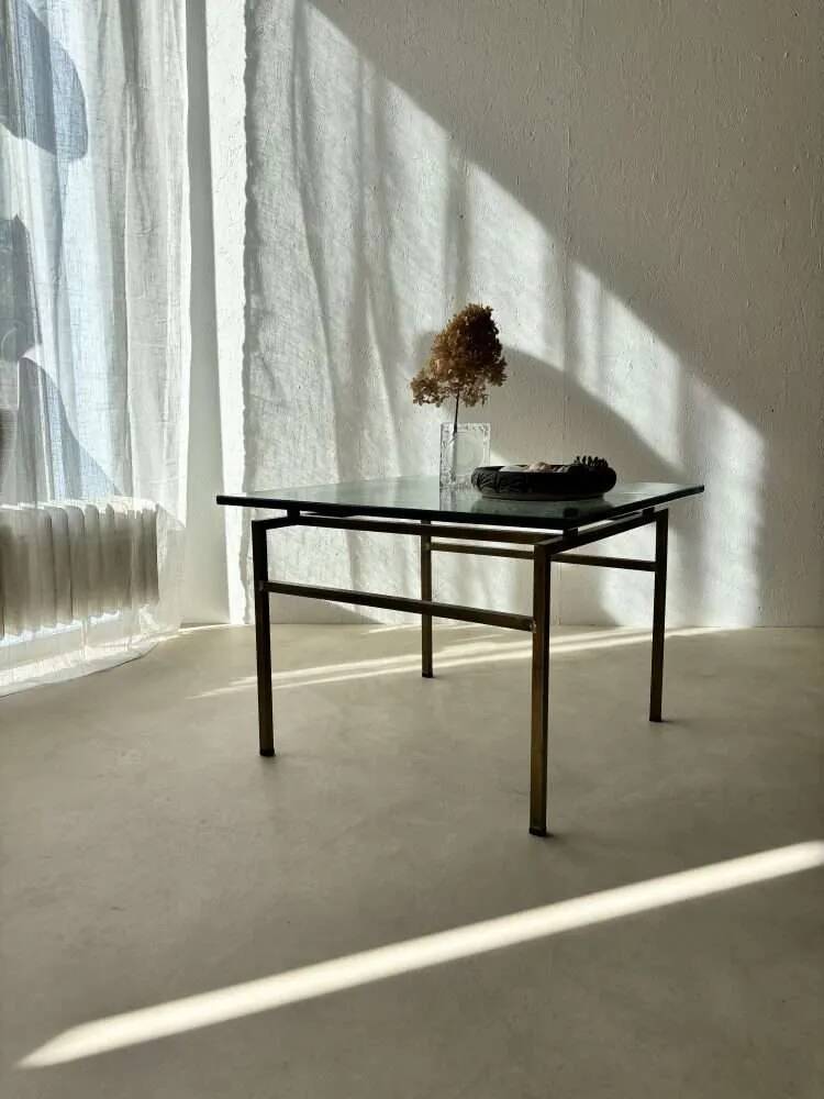 Swedish brass coffee table with a marbled glass top from the 1960s.