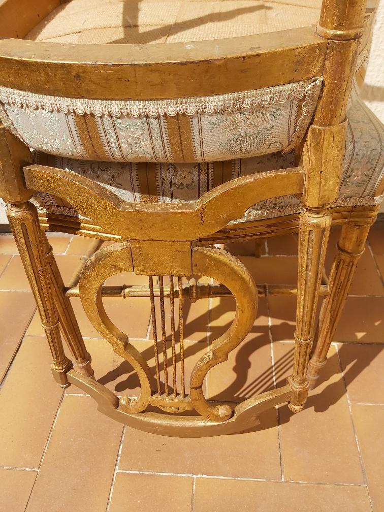 Pair of chairs with a golden lyre