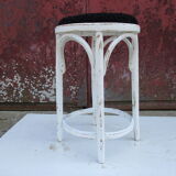 Old curved wooden stool revisited patinated white