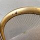 Antique brass fireplace screen from 1920, vintage spark guard.