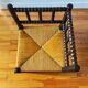 Antique corner chair made of turned wood.