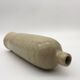Old hot water bottle in glazed stoneware, beige color