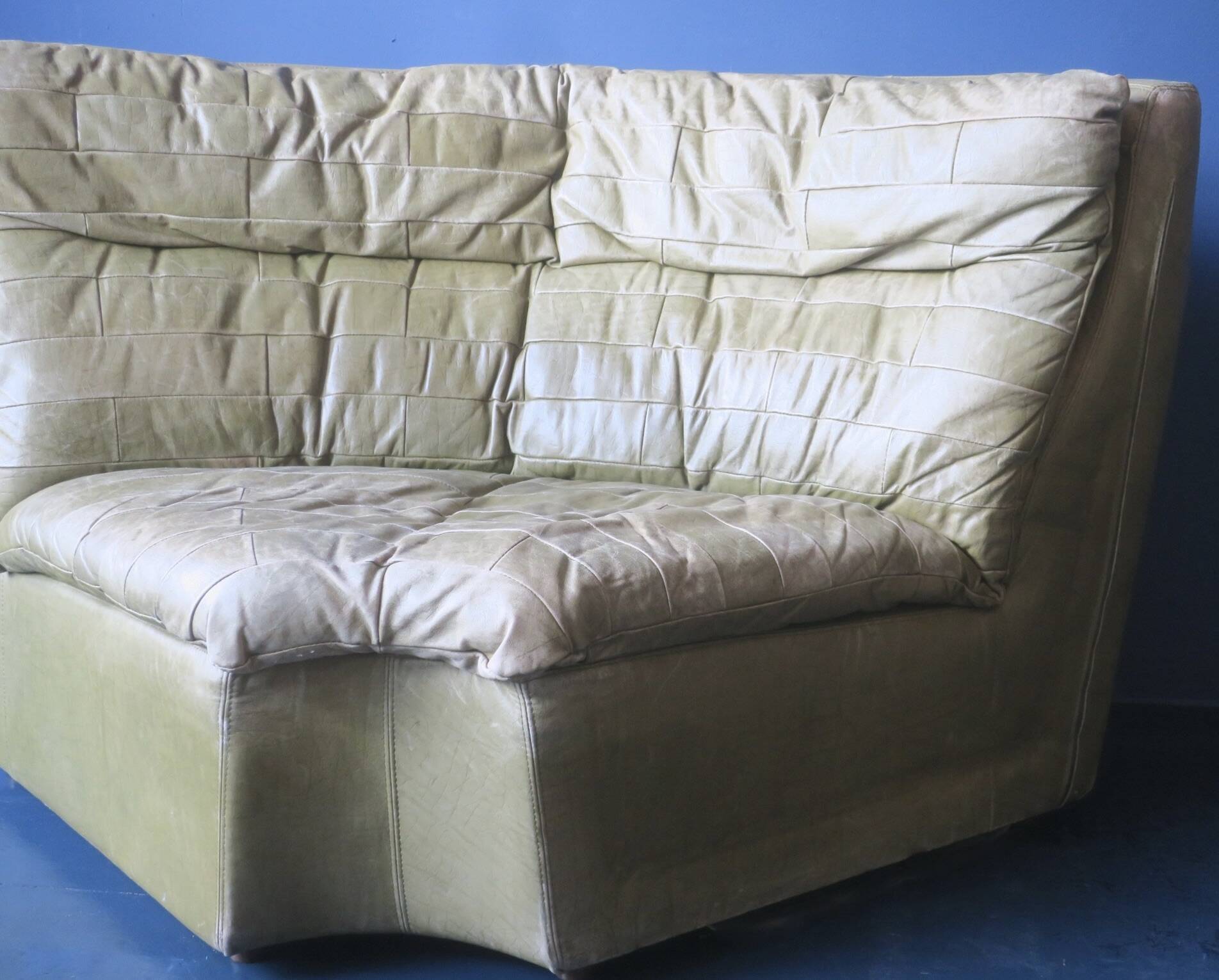 Patchwork large olive green leather corner lounge chair by Laauser, 1970s