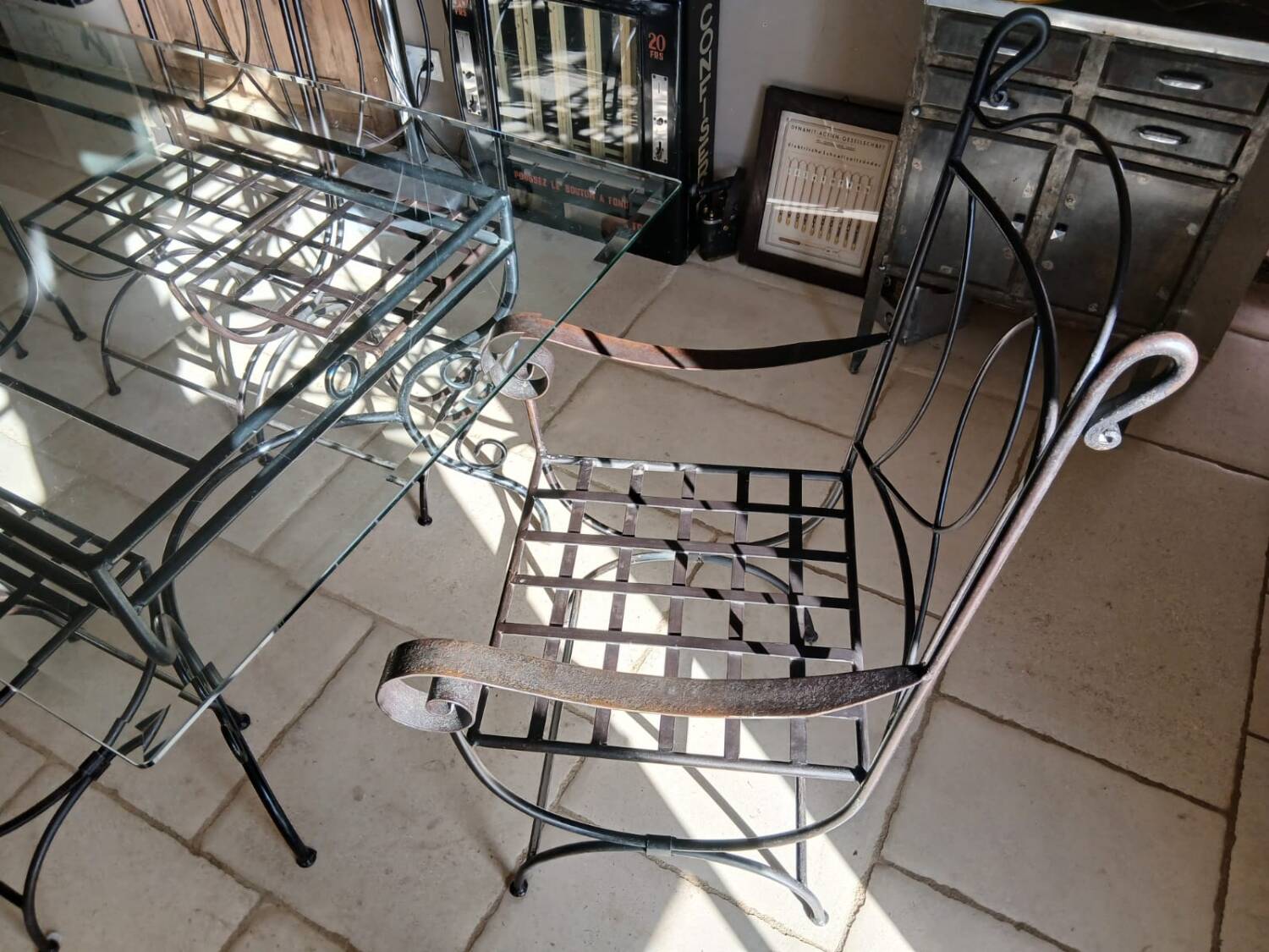 Glass table and wrought iron chairs