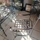 Glass table and wrought iron chairs