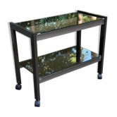 Vintage 1970s rolling bar cart made of metal and smoked glass.