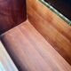 Vintage wall coat rack with storage bench from the 1970s.