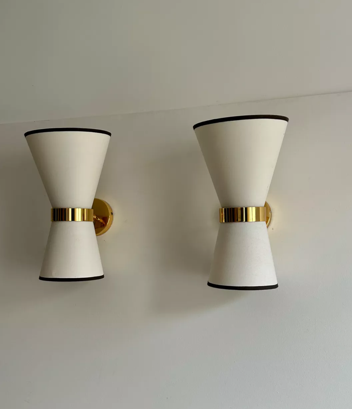 Pair of vintage wall lamps, solid brass and unbleached fabric, Italy 1980