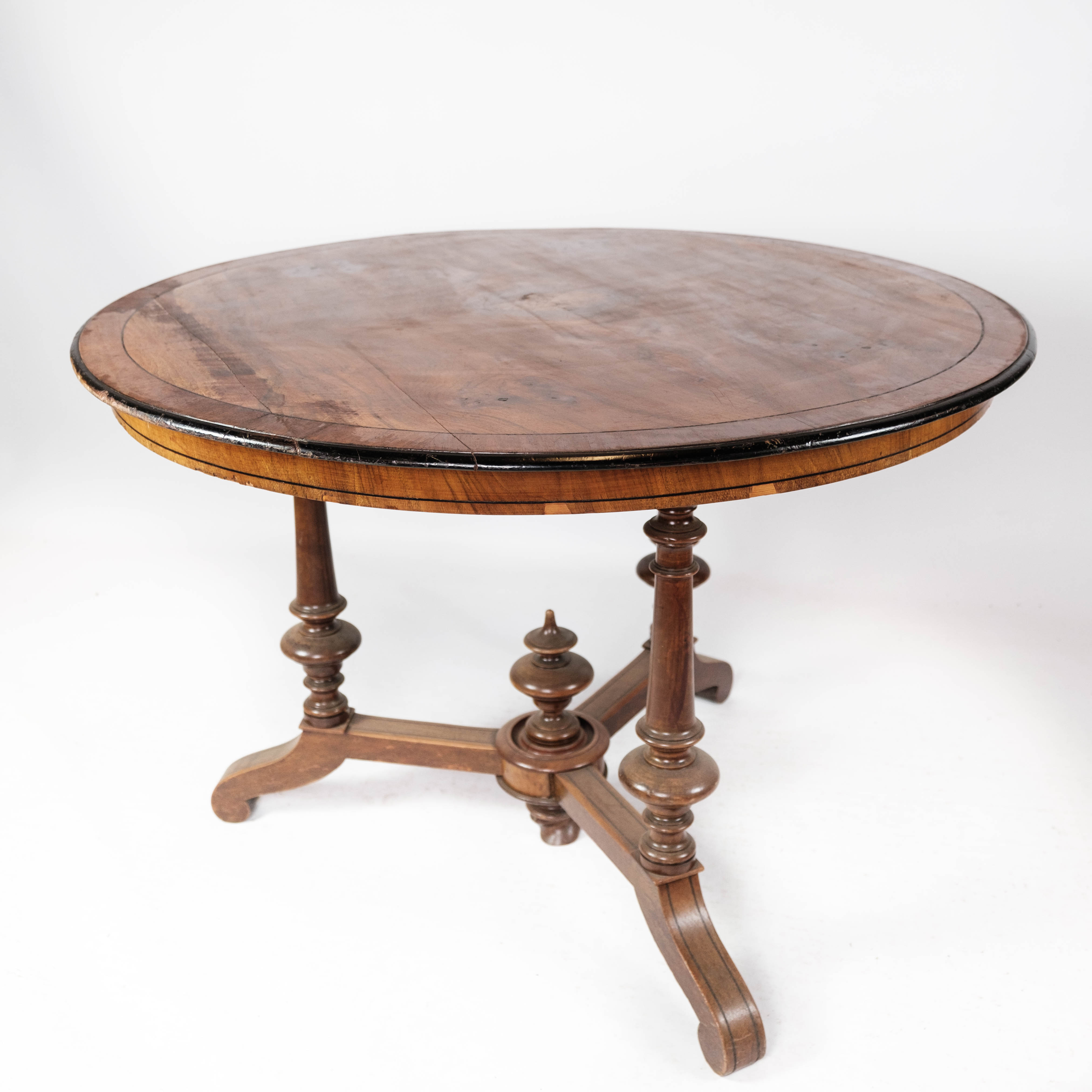 Round dining table of walnut with inlaid wood, 1890s