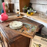 Antique wooden tray depicting a family scene