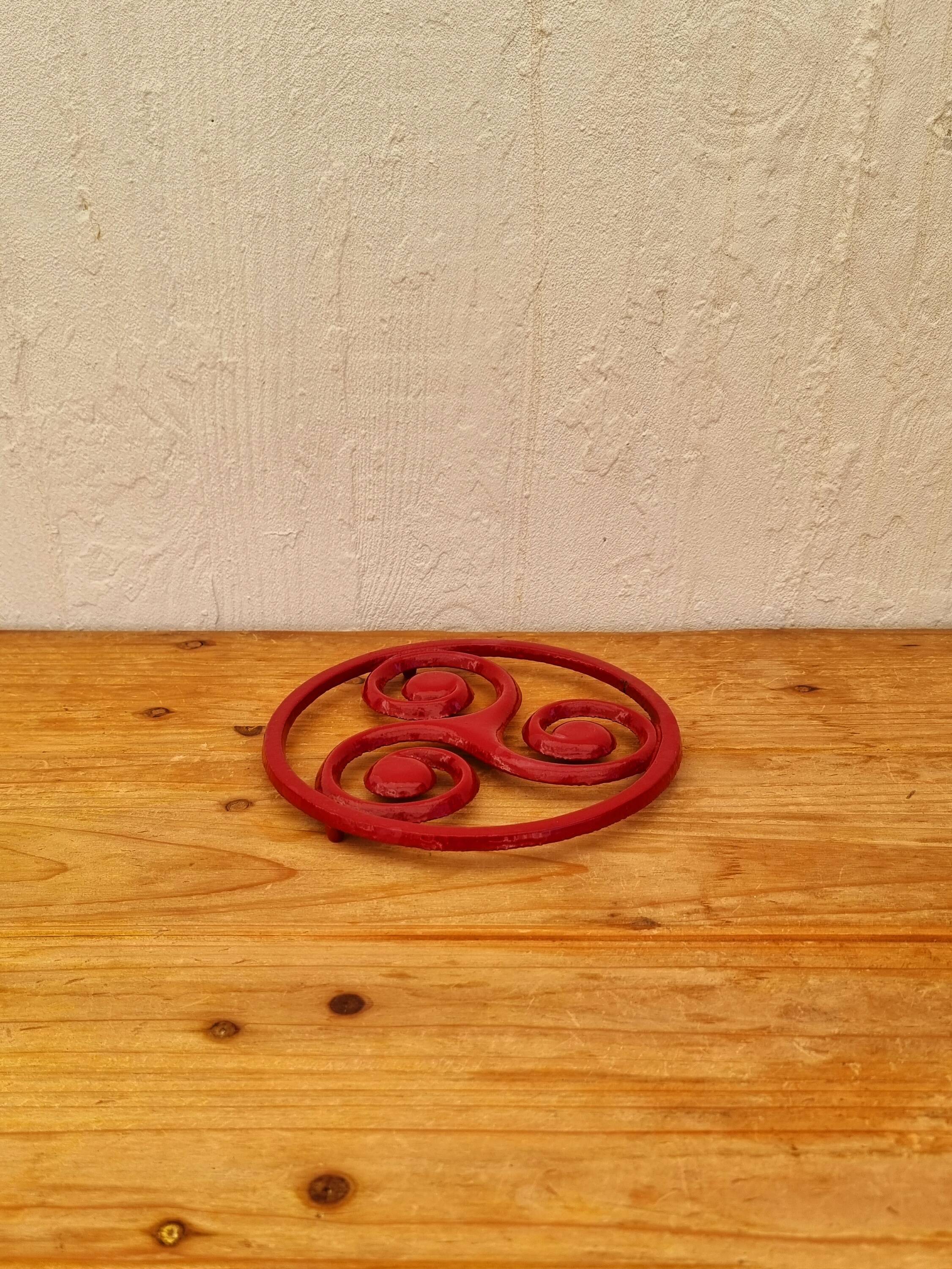 Triskelion cast iron trivet