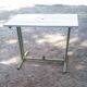 Old garden table with iron slats