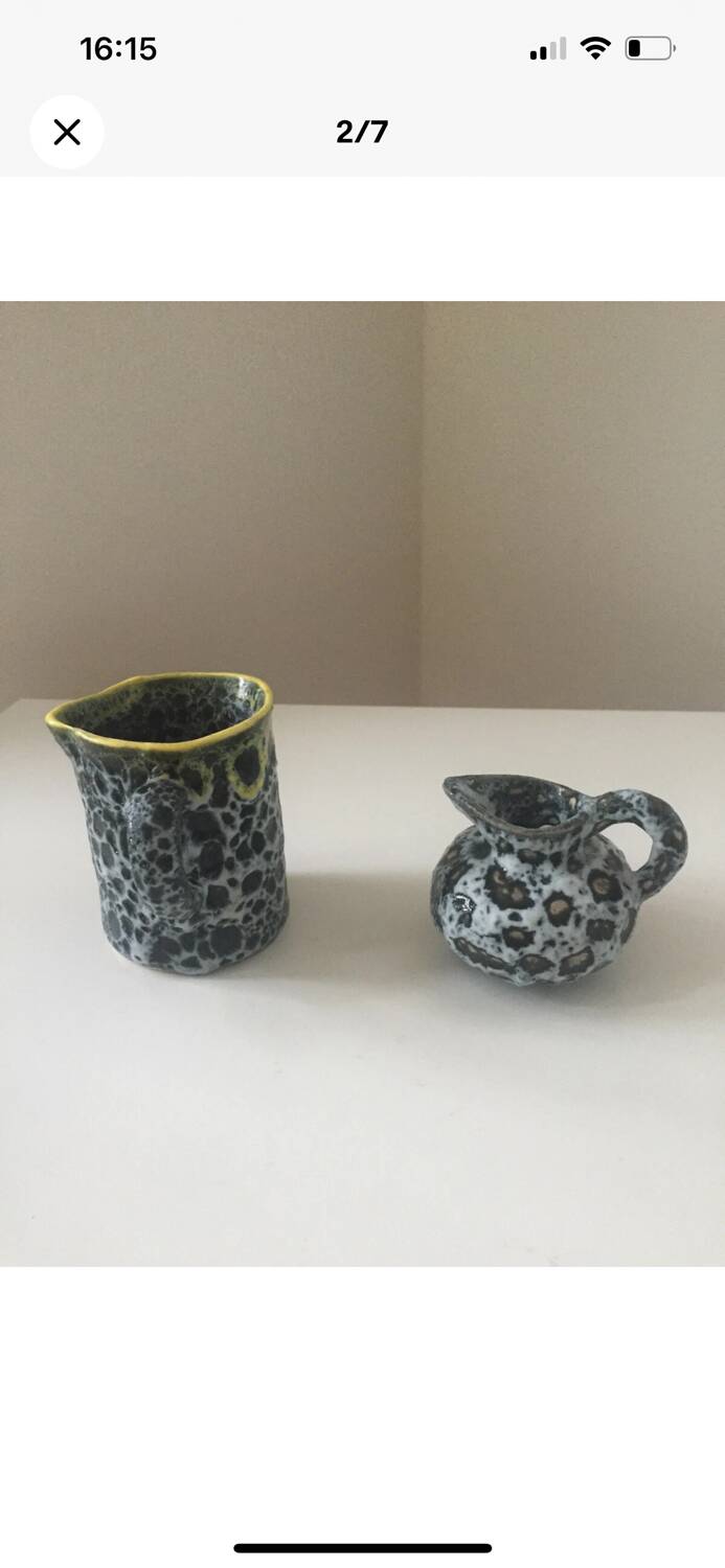 Set of two small Vallauris yellow and black milk jugs