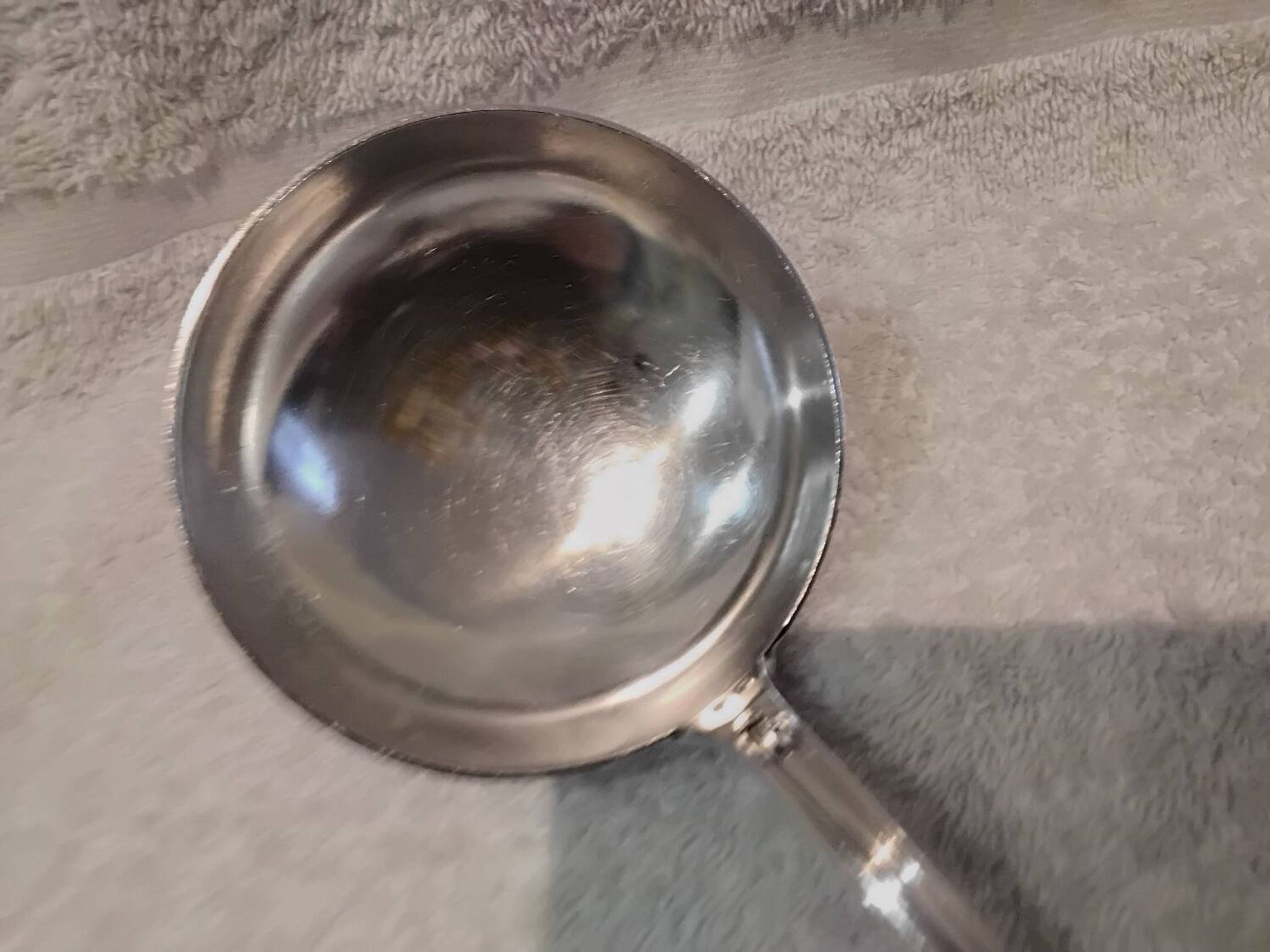 2 Silver-plated soup and sauce ladles with rocaille ribbon decoration
