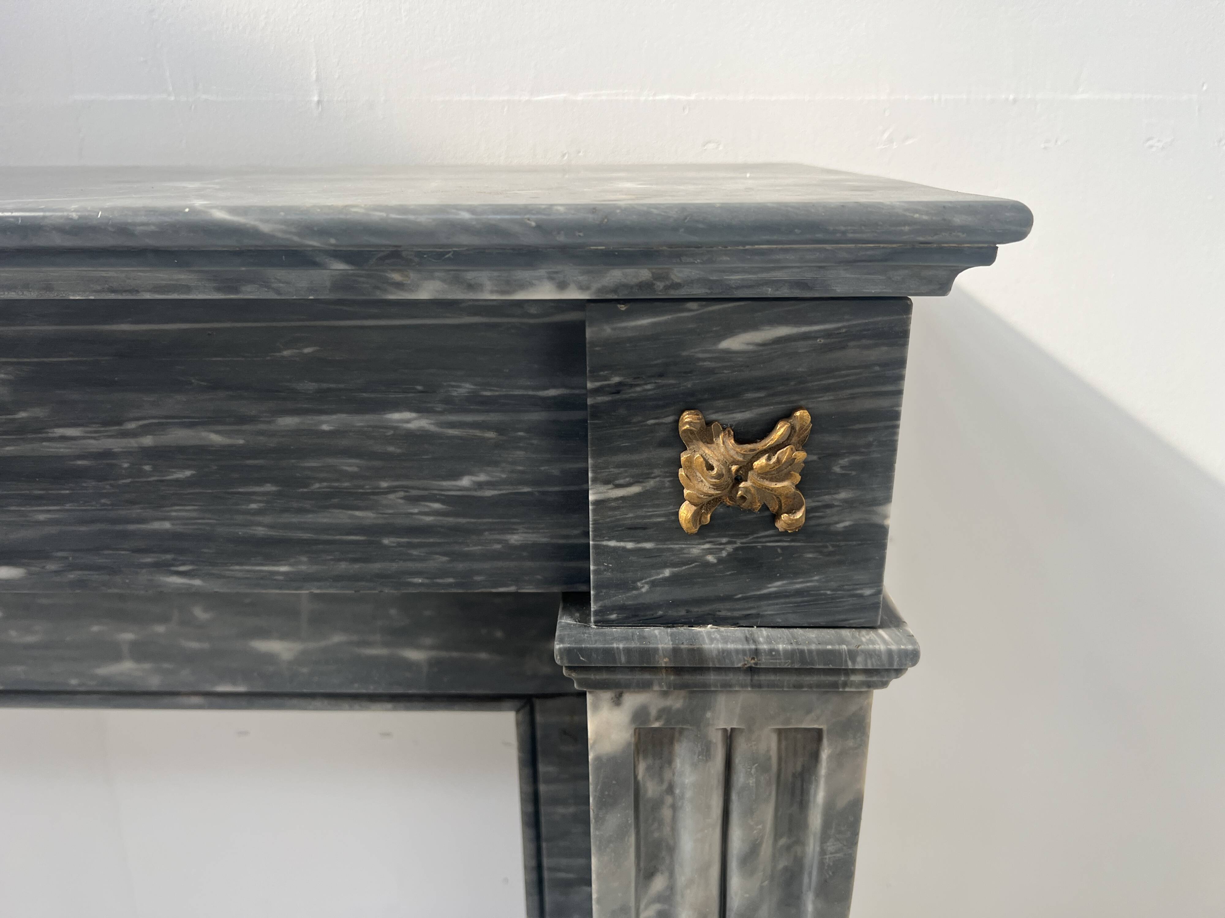 Napoleon III fireplace in blue Turquin marble from the 19th century.