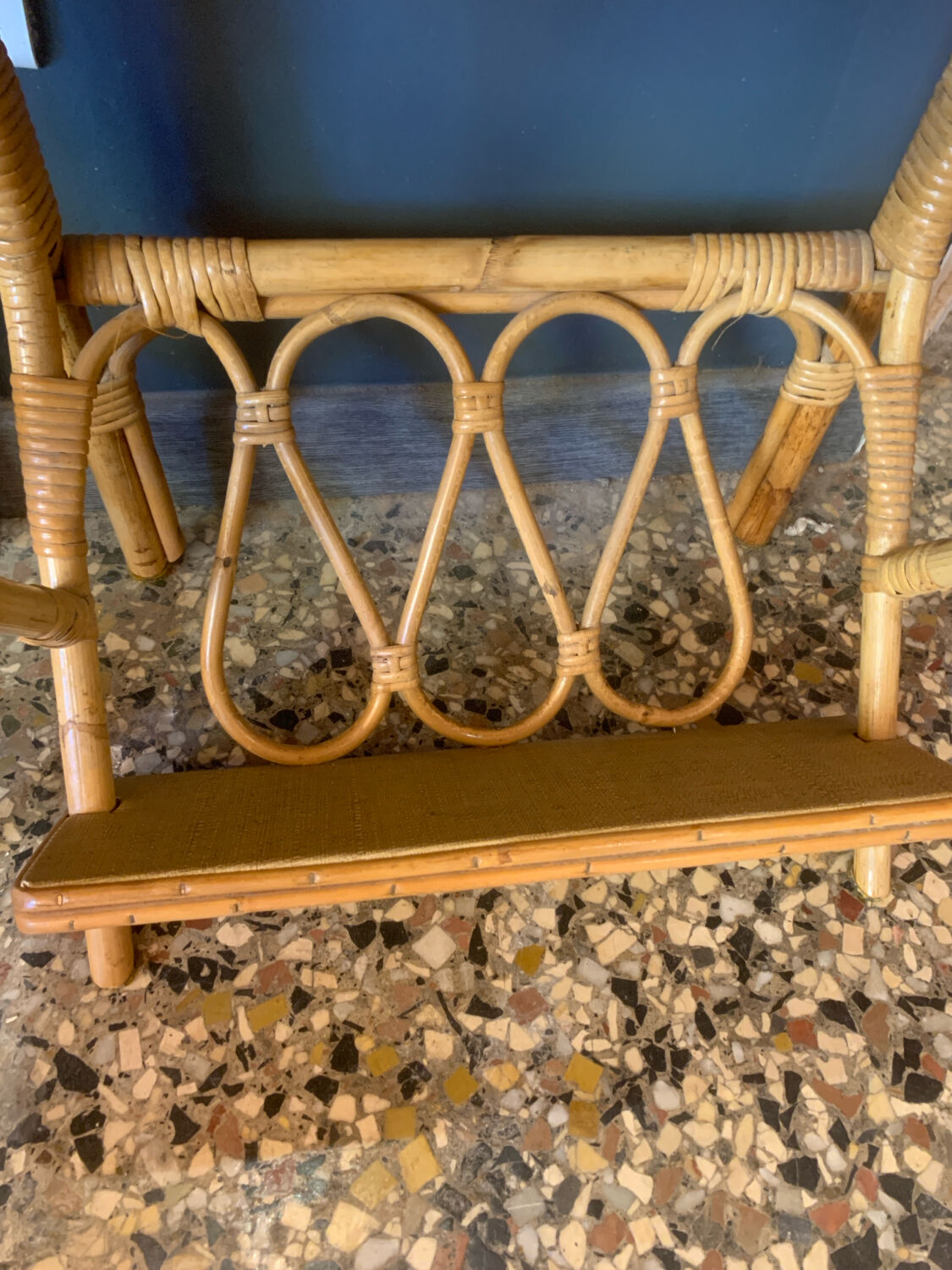 A pair of rattan bedside tables.
