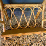 A pair of rattan bedside tables.