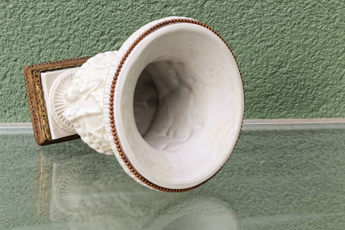 Pair of Medicis Borghese vases in porcelain biscuit and brass.