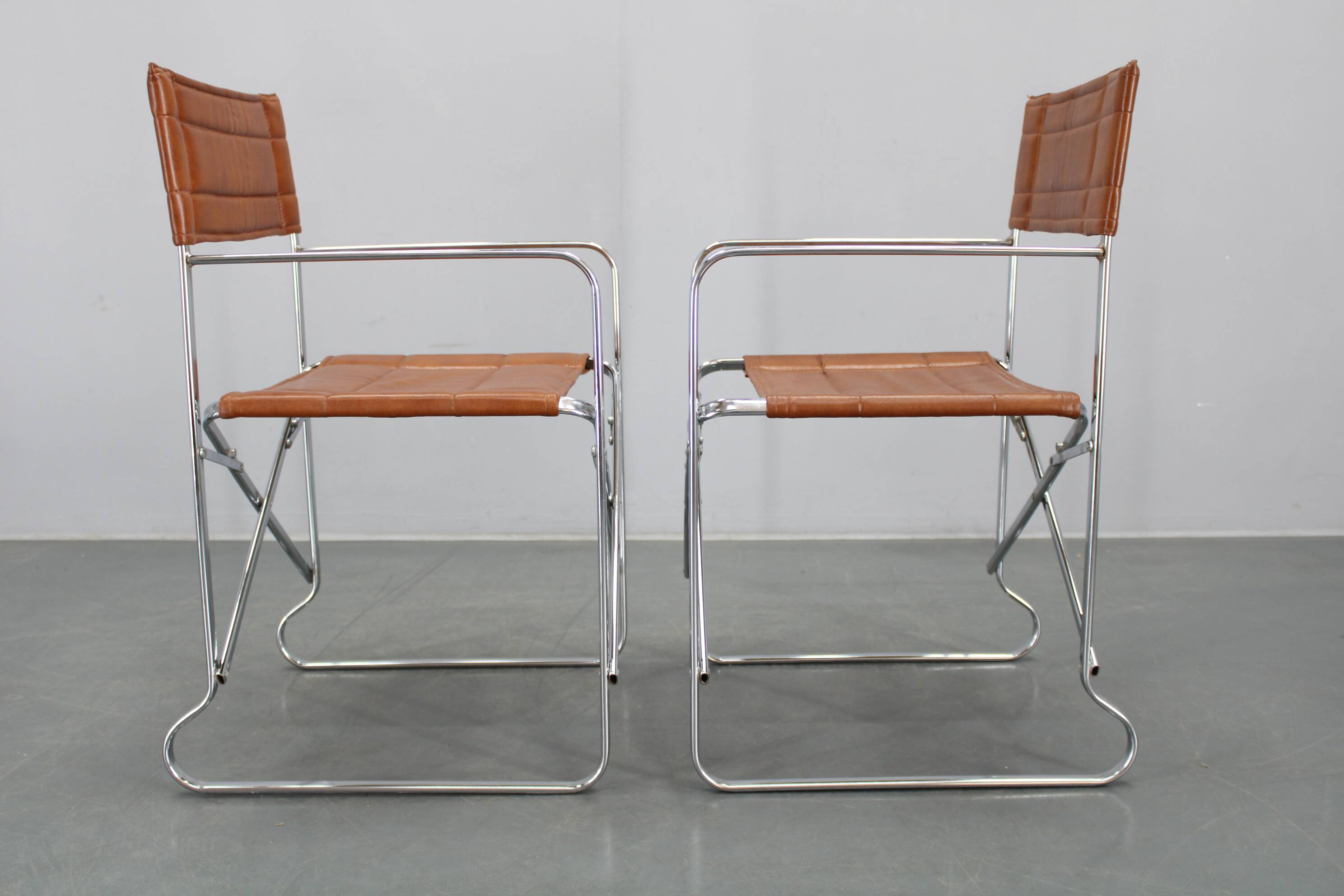 1970s pair of Italian folding chairs with leatherette upholstery