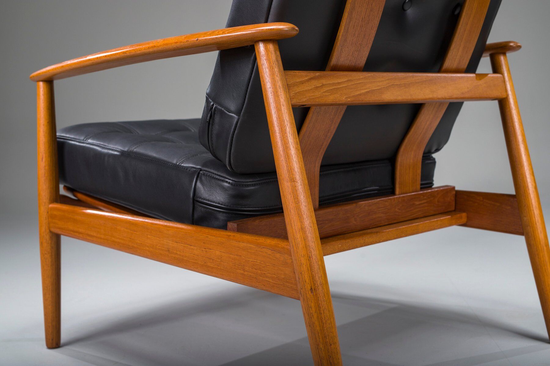 Armchair with Model FD 164 frame by Arne Vodder and Model 118 armrests by Grete Jalk in teak and black leather, Denmark, 1960s