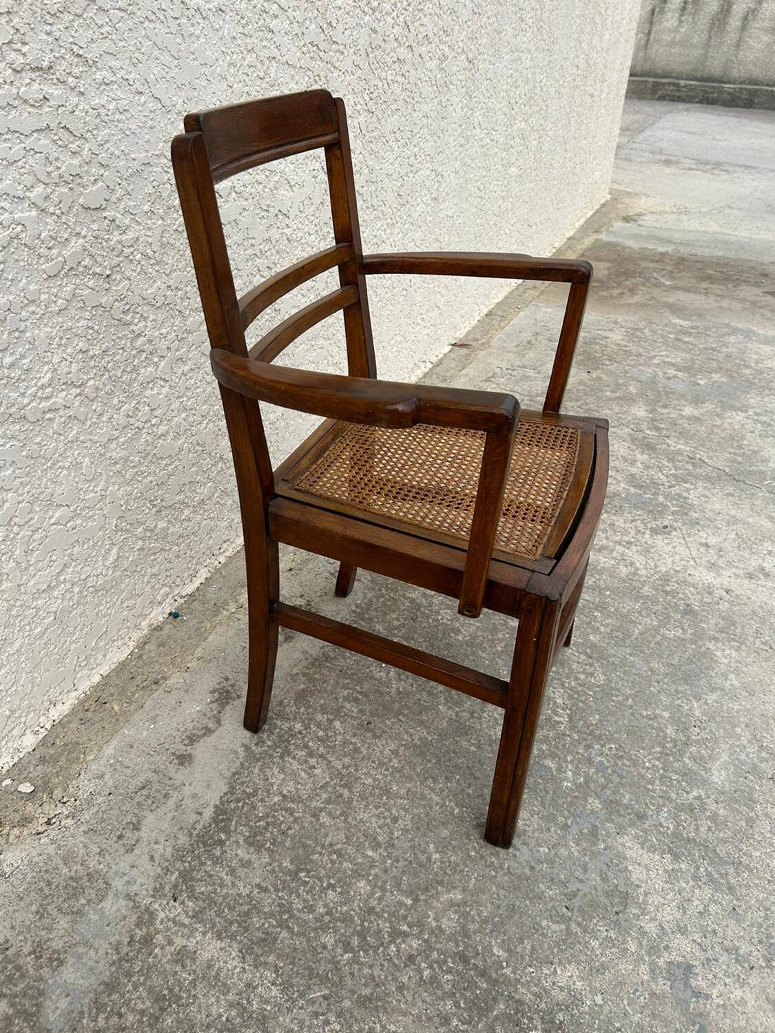 Cane armchair with armrests