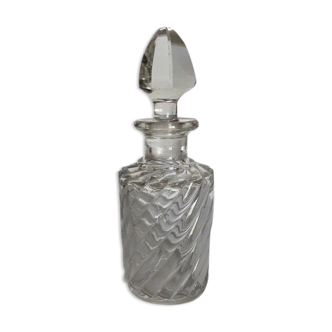 Transparent chiseled glass bottle