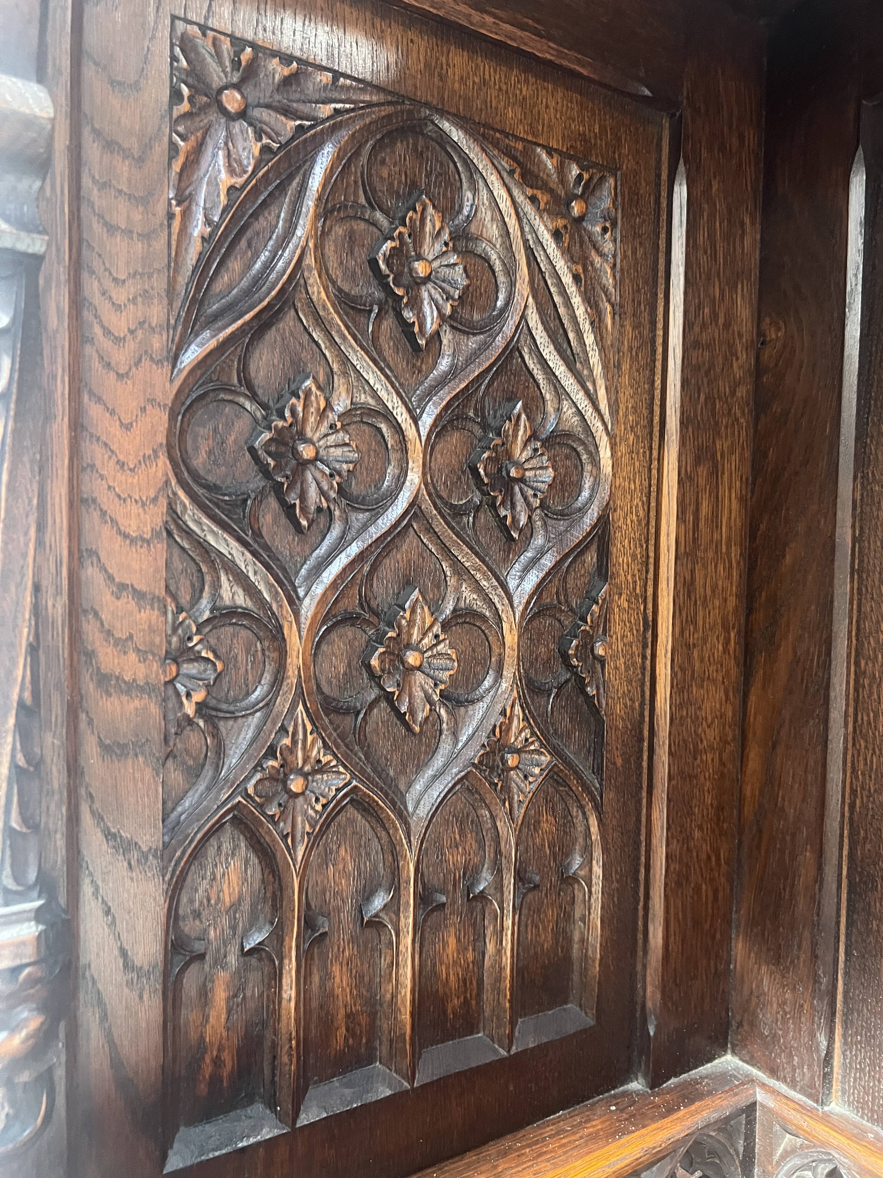 Gothic-style corner cabinet in solid oak, 20th century.