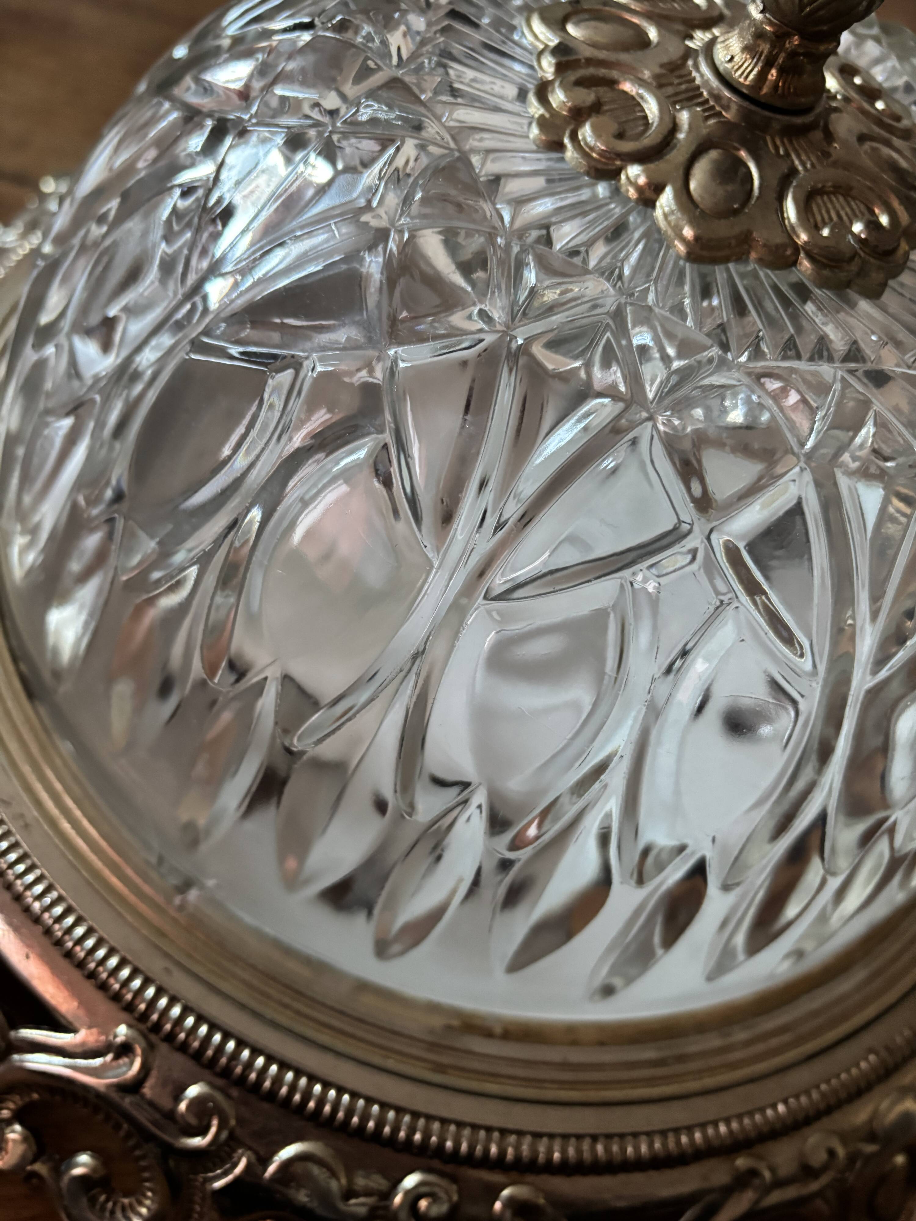 Gold ceiling light with chiseled glass globe