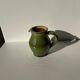 Green glazed ceramic pitcher