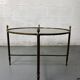 Round coffee table in brass and smoked glass