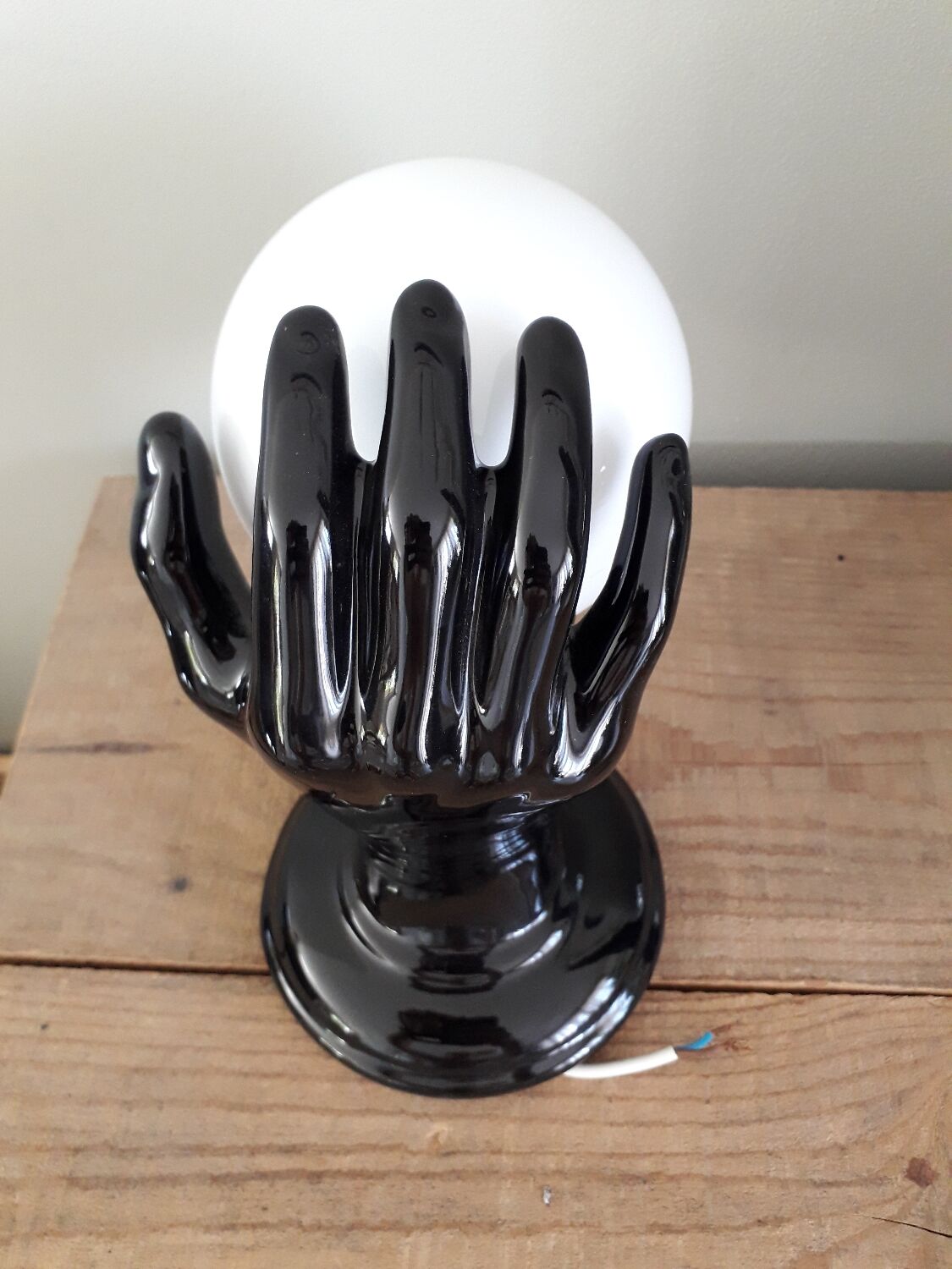 Hand and opaline globe wall light