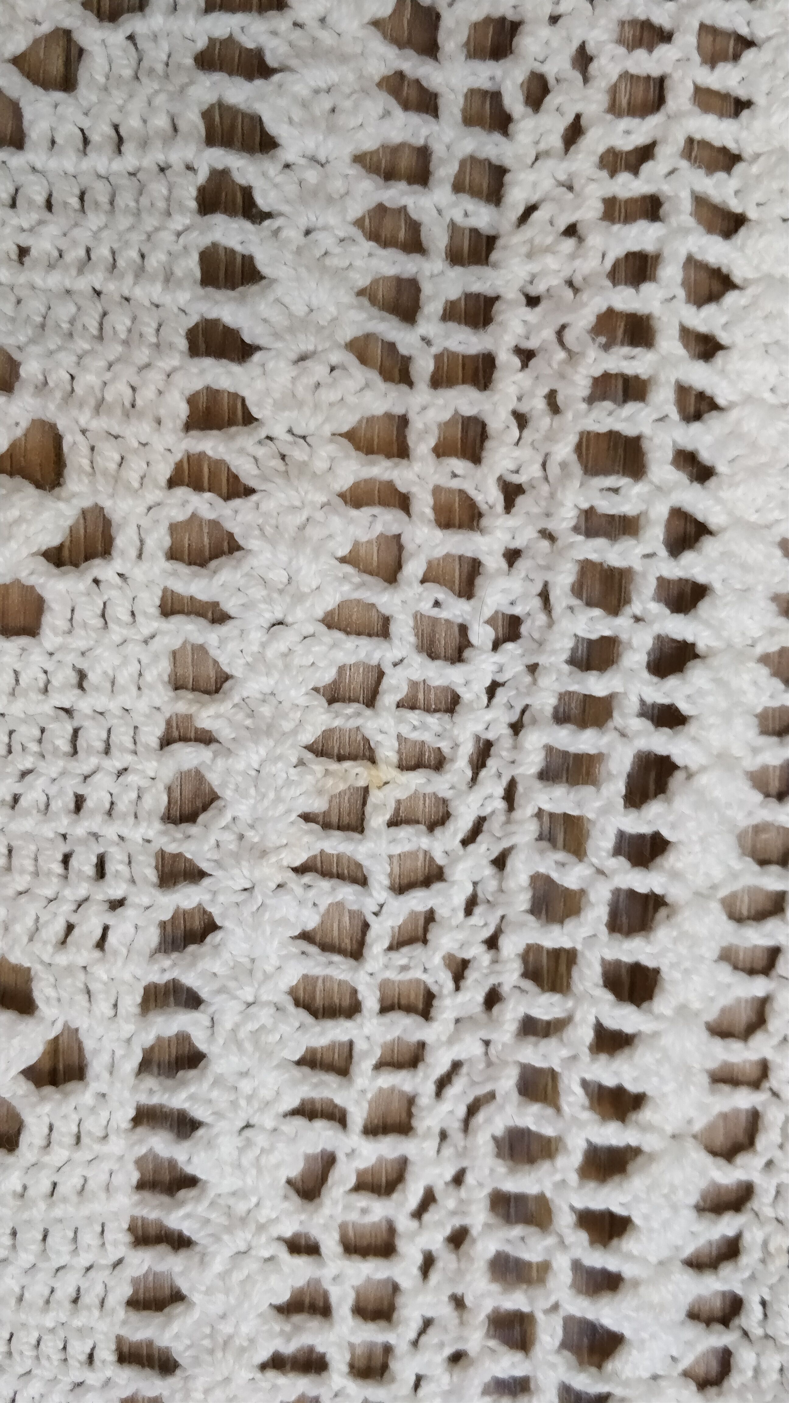 White two-seater crocheted bed top