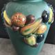 Green ceramic vase with polychrome decoration of fruits and vegetables in relief 33.5 cm